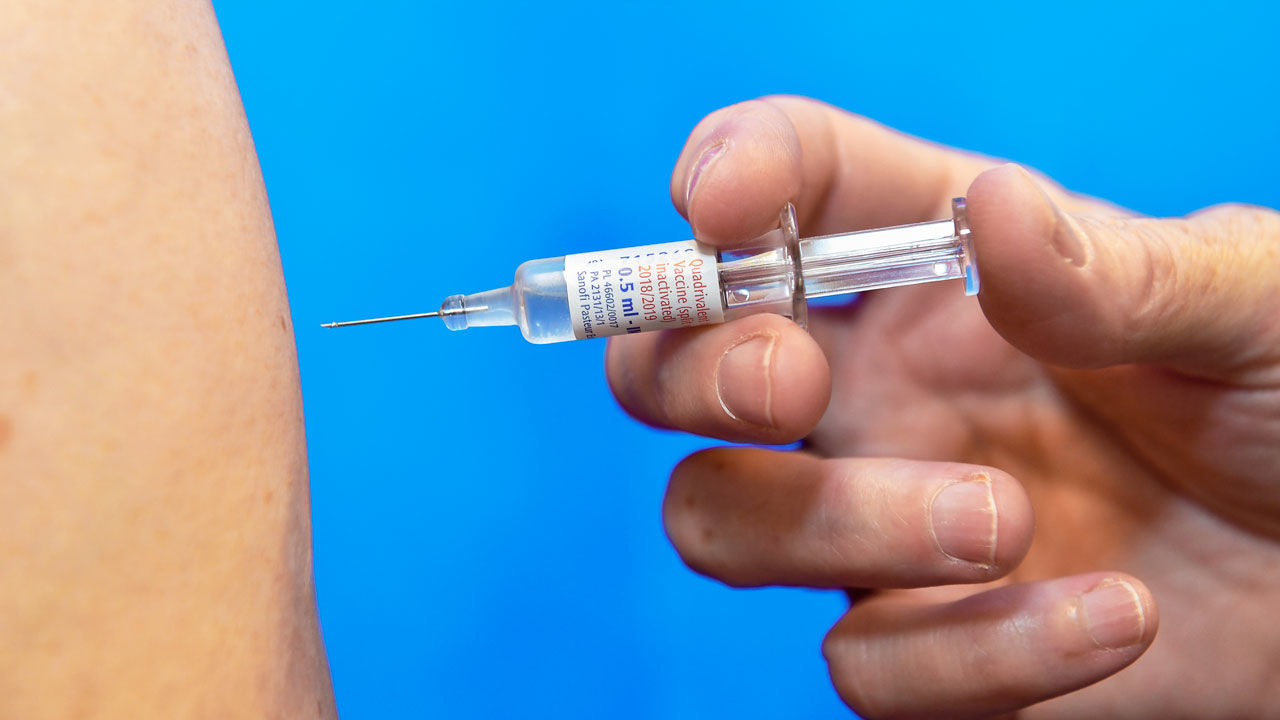 Influenza vaccine injection. Injection into a patient's arm of the 2018/2019 seasonal influenza (flu) vaccine for the northern hemisphere season. This is a quadrivalent inactivated vaccine designed for intramuscular and subcutaneous injection. Inactivated influenza vaccines contain dead influenza viruses. When injected, these stimulate the body's immune system to produce antibodies that protect against future infection by live viruses. Influenza vaccination is recommended for the elderly, the very young, and anyone suffering from respiratory or circulatory disease. It is provided annually because of the need to protect against new strains. This is a vaccine from the Sanofi Pasteur Europe company.