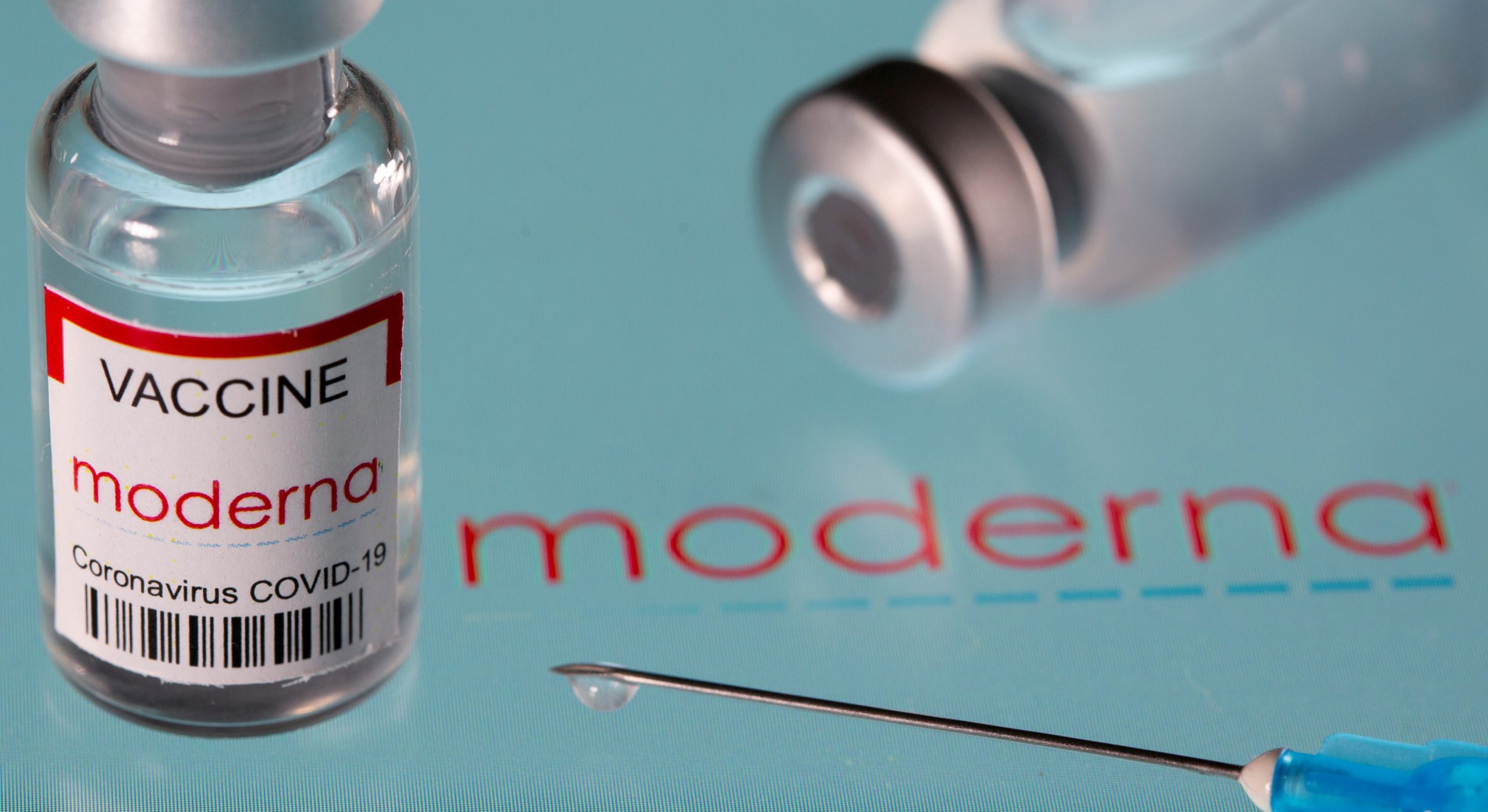 FILE PHOTO: Vial labelled "Moderna coronavirus disease (COVID-19) vaccine" placed on displayed Moderna logo is seen in this illustration picture taken March 24, 2021. REUTERS/Dado Ruvic/Illustration