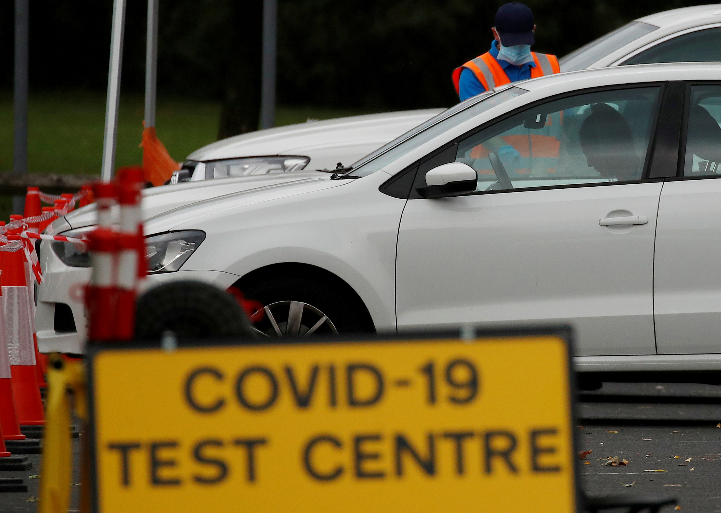 FILE PHOTO: A drive-through testing centre in Bolton, Britain, September 22, 2020. REUTERS/Phil Noble