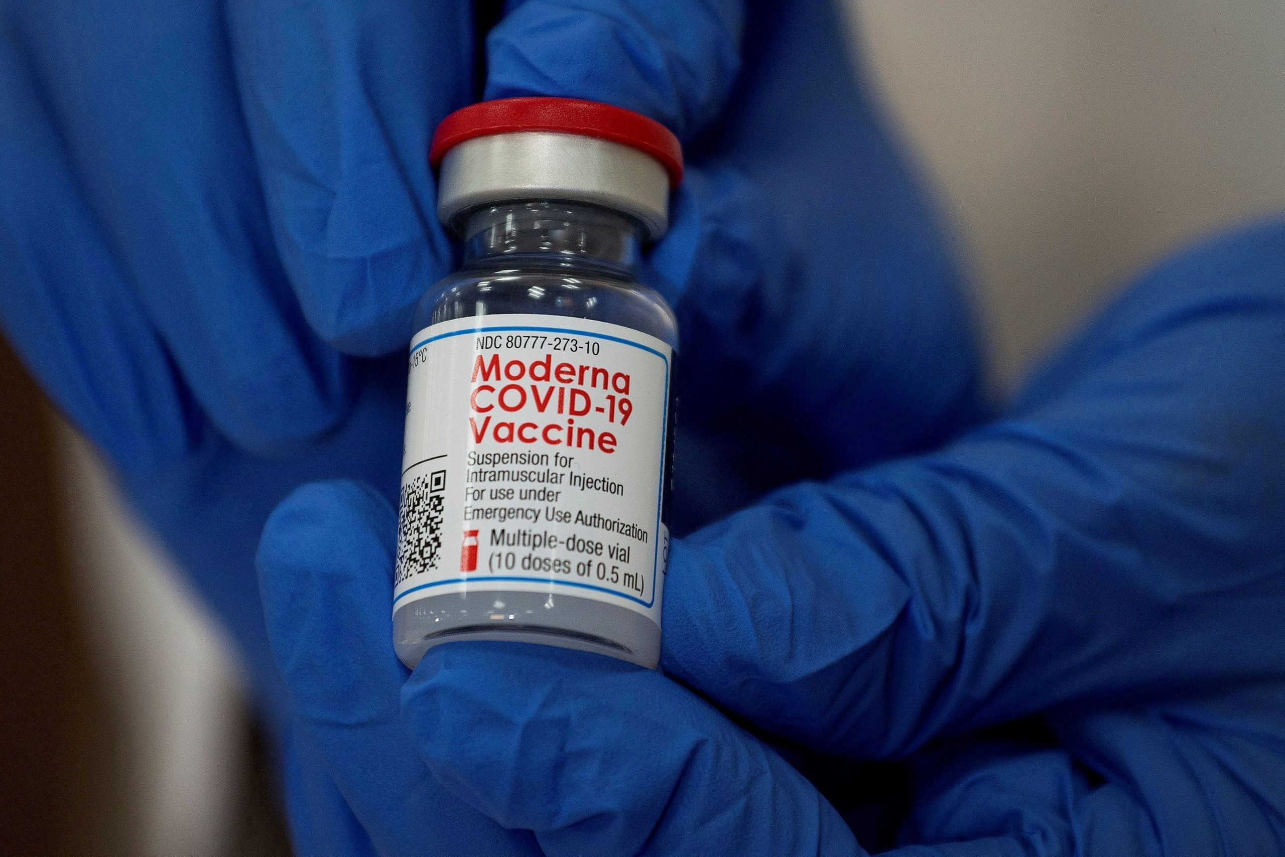 FILE PHOTO: An employee shows the Moderna COVID-19 vaccine at Northwell Health's Long Island Jewish Valley Stream hospital in New York, U.S., December 21, 2020.   REUTERS/Eduardo Munoz/File Photo