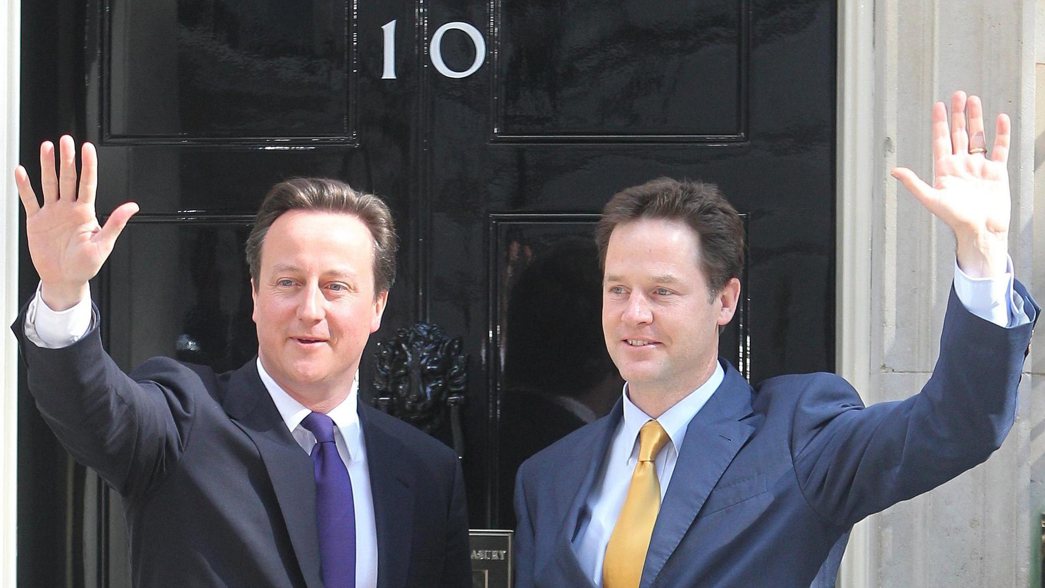 The new British Prime  Minister David Cameron (left) with the new Deputy Prime Minister Nick Clegg on the steps of 10 Downing Street in central London, before getting down to the business of running the country. PRESS ASSOCIATION Photo. Picture date: Wednesday May 12 2010. The pair went to work hours after finally putting together their historic Tory/Lib Dem coalition government. See PA story POLITICS Coalition. Photo credit should read: Lewis Whyld/PA Wire