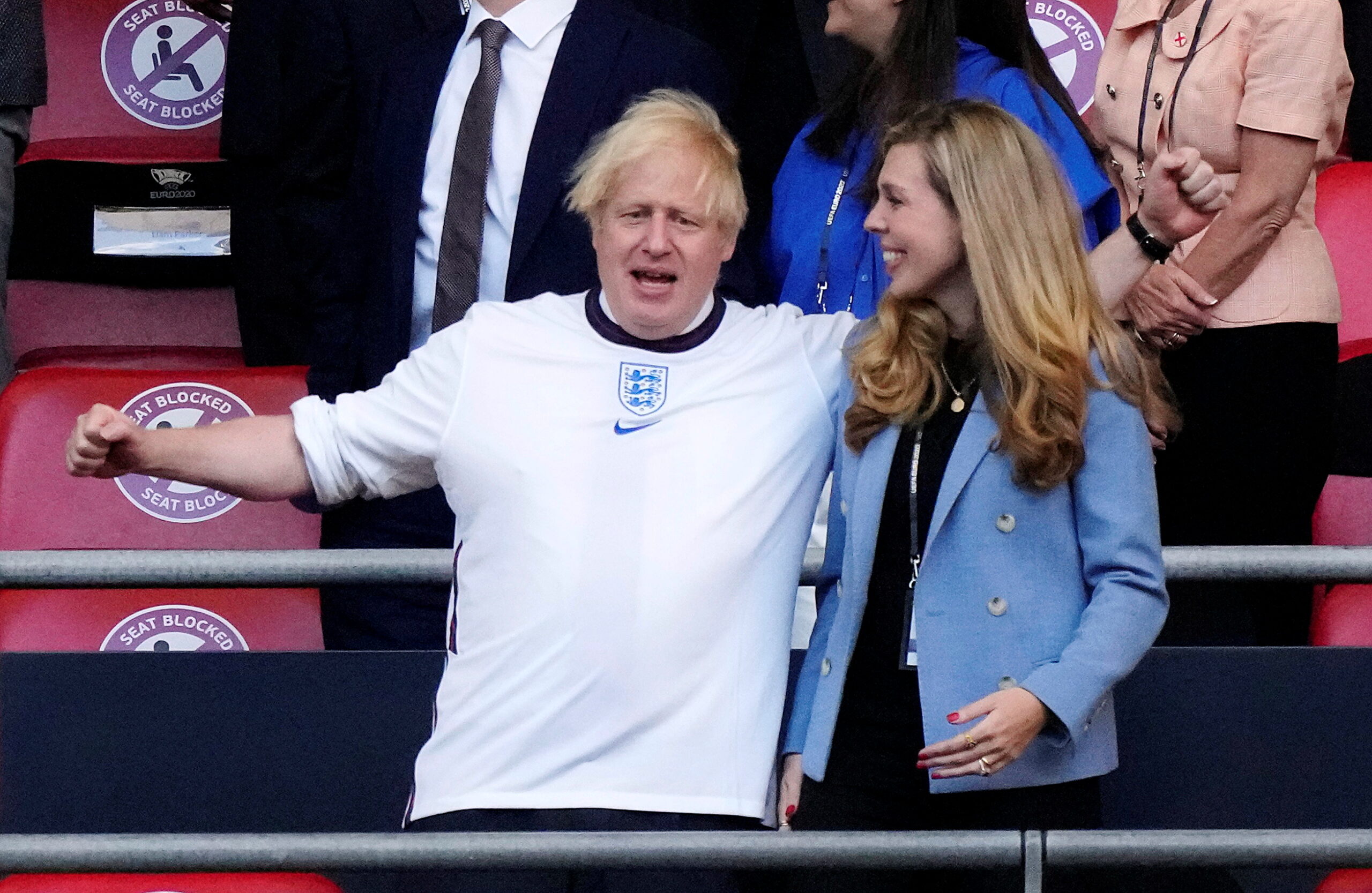 Soccer Football - Euro 2020 - Semi Final - England v Denmark - Wembley Stadium, London, Britain - July 7, 2021 Britain's Prime Minister Boris Johnson with his wife Carrie Johnson in the stands before the match Pool via REUTERS/Frank Augstein