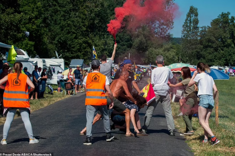 Tour de France Fans Drag Eco-protesters Trying to Block Race Off the Road