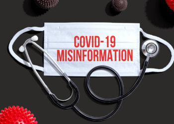 Covid-19 Misinformation theme with medical mask and stethoscope