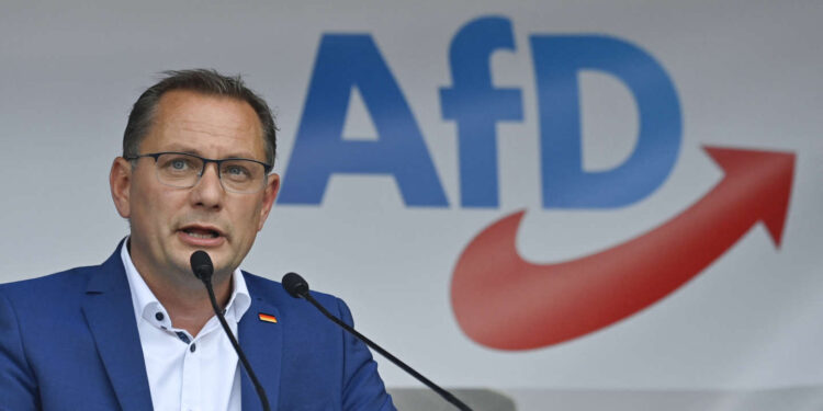 Far-right Alternative for Germany (AfD) party's co-leader and top candidate in the upcoming election, Tino Chrupalla addresses a rally of the AfD party for the launch of the electoral campaign ahead of the September 26 federal elections, in Schwerin, northern Germany, on August 10, 2021. (Photo by John MACDOUGALL / AFP)