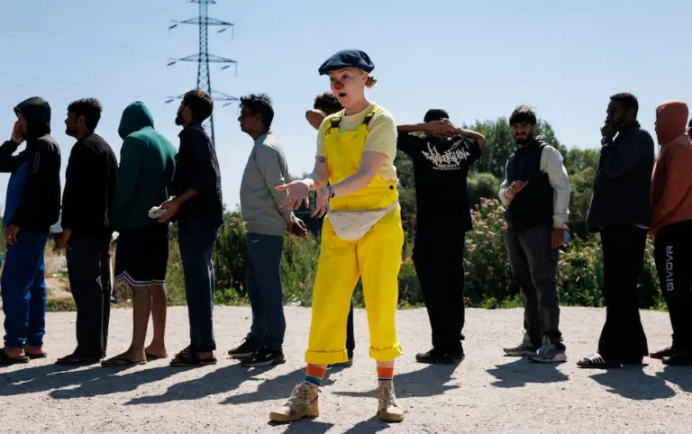 Clowns Entertain Migrants as People-Smugglers Plot Channel Crossings 50 Metres Away